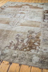 Expressive Oushak design detail in abrash bronze, beige, and charcoal tones.
