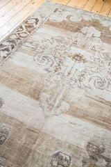 Vintage Oushak rug's abrash pile in bronze, silver, beige, and charcoal.