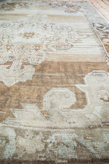 Detailed abrash texture of vintage Oushak rug, showing beige, bronze, and charcoal tones.