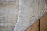 Woven foundation and hand-finished edge of the distressed Oushak runner.