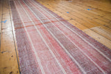Textured flat woven Kilim runner in rose red and wine burgundy striations.