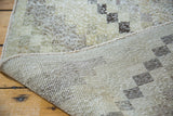 Vintage distressed Oushak rug with checker motif, showing textured pile and woven back.