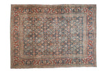 Antique Tabriz rug with allover Herati pattern on indigo blue field, rusty red border.