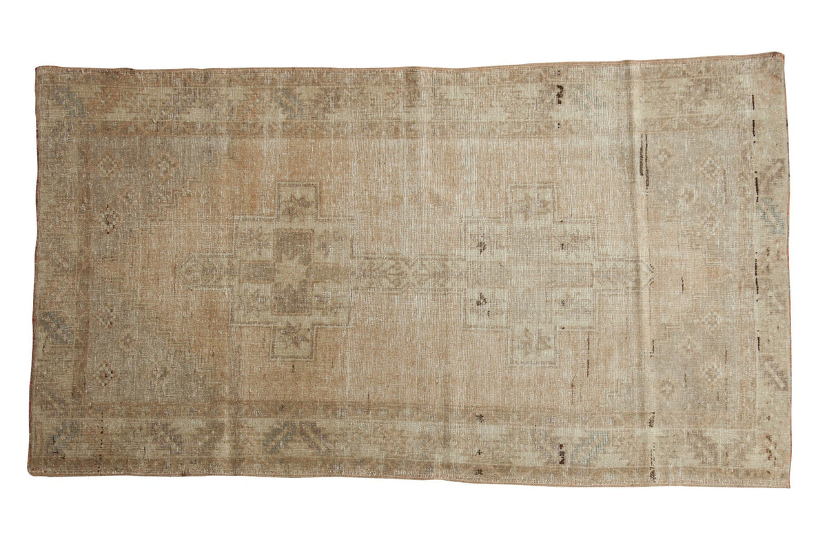 Vintage distressed Oushak rug, circa 1950s, blanched apricot ivory with faded medallions.