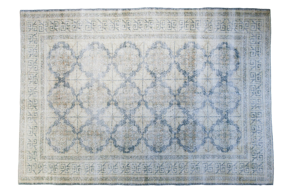 Vintage distressed Turkish Oushak carpet, ivory field, muted blue lattice medallions, 6'7" x 9'3".