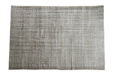 Distressed Oushak Carpet with subtle repeating medallions in muted beige and greyish tones, 6'5