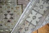 Detail of distressed Oushak rug reverse, revealing its woven foundation and softened pile.