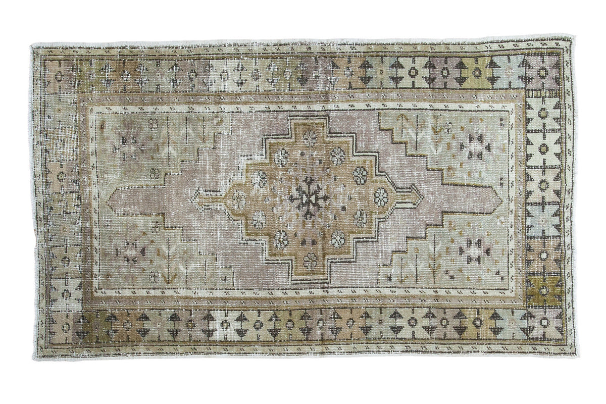 Distressed Vintage Oushak runner with medallion in softened bronze, celadon, light blue, mauve.