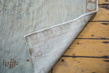 Hand-knotted foundation and distressed silvery gray, beige Oushak rug pile.