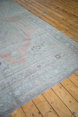 Oushak carpet corner, blanched platinum and soft cinnabar coral floral borders, fringe detail.