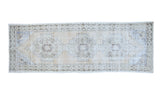 Distressed Oushak runner rug with triple geometric medallions in light goldeny beige, ivory, and silver charcoal.