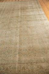 Softened blanched ivory, green, beige hues and intricate weave on this distressed Oushak rug.