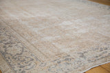 Distressed texture and faded beige allover pattern on a vintage Turkish Oushak carpet.