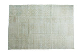 Distressed vintage Oushak carpet with muted green and cream faded medallion patterns. 6'10