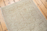 Blanched distressed Turkish Oushak runner with scrolling vines.