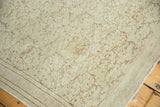 Blanched distressed Kaisary runner showing scrolling vines and thin pink stripe border.