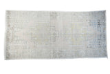 Distressed vintage Oushak runner with soft apricot, gold, and charcoal geometric motif, 4'2