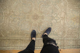 Distressed vintage Turkish Oushak runner showcasing muted ivory, silver-blue, and brown patterns.