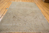 Vintage Oushak rug with soft sandy earth tones and tone-on-tone distressed texture.