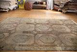Visible scattered restorations and textural character of a distressed vintage Oushak rug.