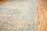 Curvilinear teal medallions and scrolling palmette border on distressed Oushak runner.