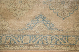 Detail of distressed Oushak runner with faded teal and softened rose scrolling palmettes.