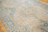 Distressed Oushak runner with faded teal medallions and softened rose palmette patterns.