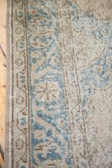 Distressed Oushak runner, softened teal and beige scrolling palmette border.