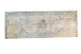 Distressed Oushak runner with soft beige and teal scalloped medallions, flowing palmette border.