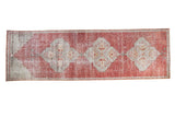 Distressed vintage Oushak runner with triple grey medallions, faded cinnabar red field, and mehrab, 2'10