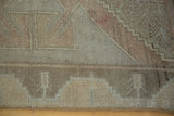 Oushak runner border detail: geometric pattern in softened beige, rose, and earth tones.
