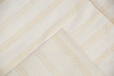 Bleached ivory dhurrie flatweave rug with beige-gold stripes and fine cotton weave.