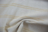 Finely woven dhurrie texture with bleached ivory and beige stripes on the vintage carpet.