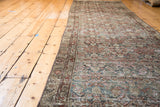 Detail of distressed Malayer runner, Herati pattern in slate blue, grey, brick red.