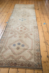 Vintage Konya runner's geometric pattern detail with beige, soft brown, and contrasting blue.