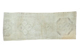 Creamy beige hand-knotted Oushak runner with subtle geometric medallions, 2'6