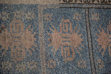 Unique geometric rendering in powder blue and beige tones on vintage Oushak hand-knotted pile.