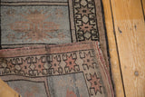 Folded vintage Oushak runner showcasing geometric patterns in powder blue and muted pink.