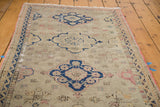 Distressed Oushak runner with tarnished navy and dusty grey-ivory medallion.