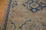 Textural distressed Oushak runner with tarnished navy and terra cotta motifs on dusty grey.