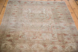 Distressed Kaisery rug with intricate floral motifs and etched pile texture.