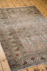 Vintage 1940s Kaisery rug: subtle etching of intricate floral patterns and scrolling vines.