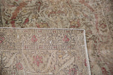 Intricate hand-knotted foundation of distressed Turkish Kaisery rug with muted floral pattern.