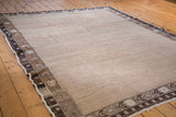 Detailed view of a distressed Oushak rug border, geometric motifs frame its abrash field.