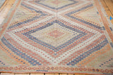 Intricate hand woven Jijim rug pattern with colorful zig-zag and diamond motifs.