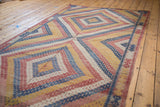 Hand-woven vintage Jajim carpet's geometric diamonds in denim blue, grapefruit red, ivory, yellow.