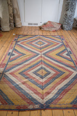 Vintage Jajim carpet edge, hand woven geometric pattern in blue, red, saffron gold, ivory.