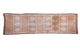 Hand woven vintage Jijim runner featuring soft terracotta and beige diamond patterns, 2'4