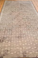 Distressed geometric pattern in charcoal, ivory, and brown on a vintage Jajim runner.