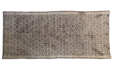 Distressed vintage Jijim runner, intricate geometric pattern in charcoal, ivory, silver, brown tones.